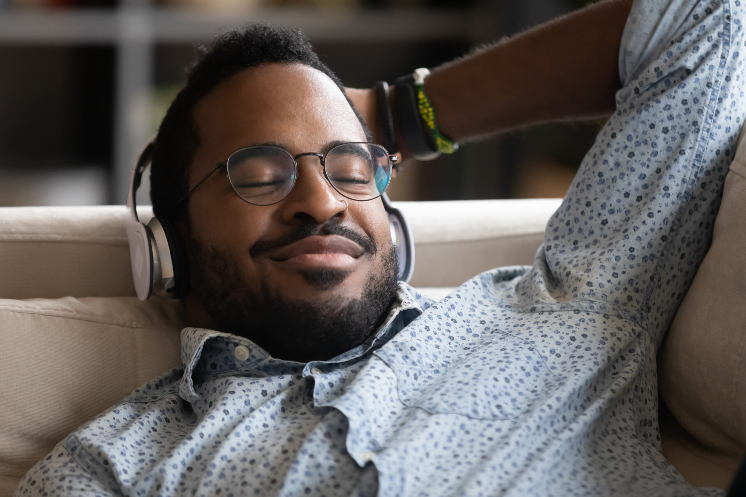Close Up Satisfied African American Man Wearing Headphones Enjoy